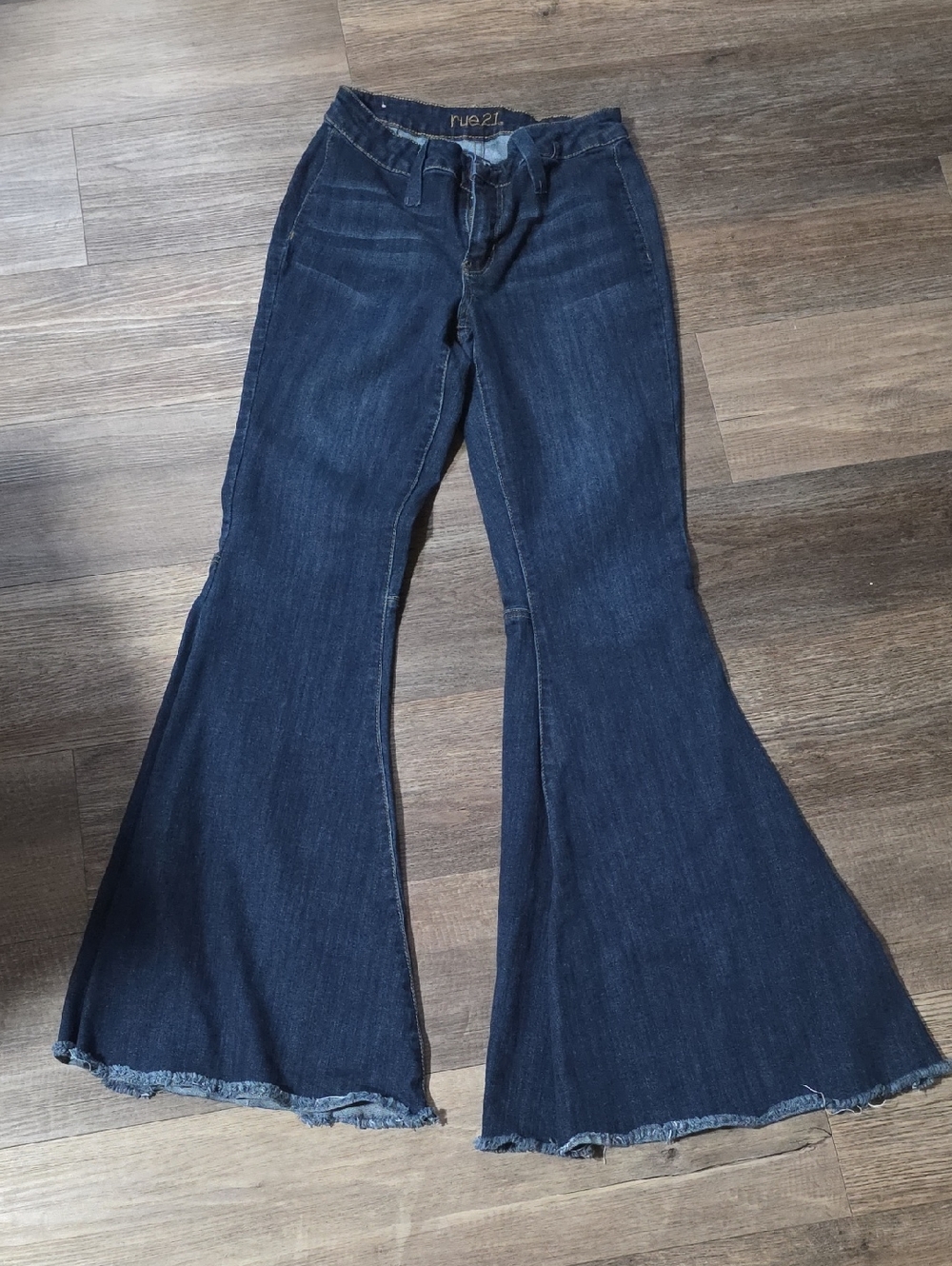 Rue21 Dark Blue Flare Jeans with Raw Hem.